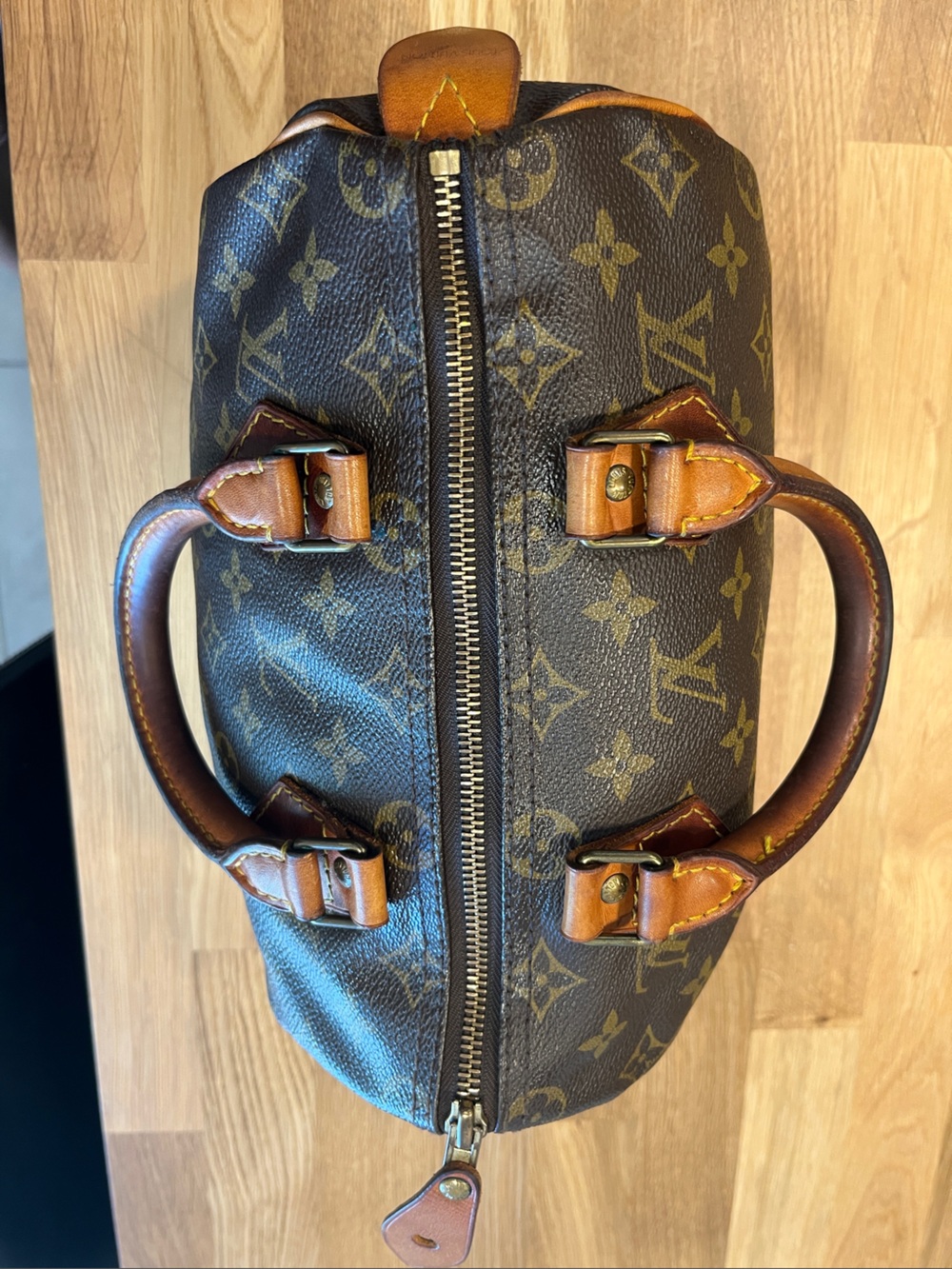 Louis Vuitton Vintage Brown Monogram Speedy 25  Handbag with Tan Leather Trims.